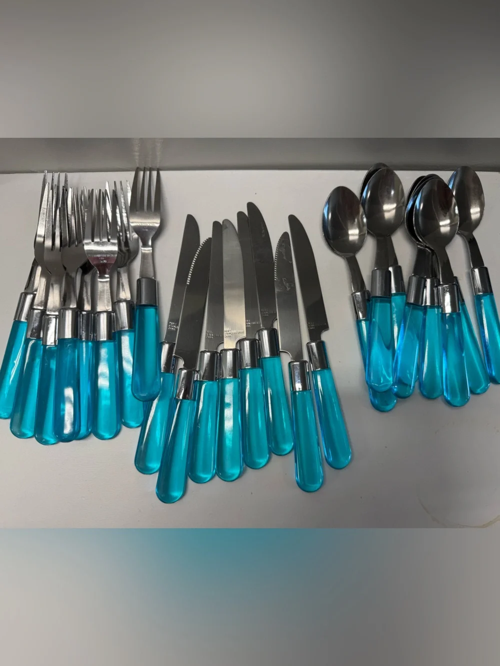 24 pieces Pier 1 Acrylic Handle Flatware Blue Transparent Spoons Knives Forks